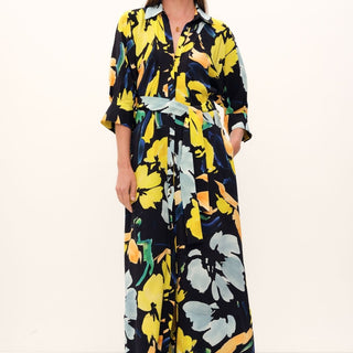 The Hereafter Shirt Dress by GINGER & SMART. Artful-painted florals on navy silk crepe give a luxurious drape and crisp feel. Tailored with a sharp collar, cuffed 3/4 sleeves, button-down front, and belted waist.