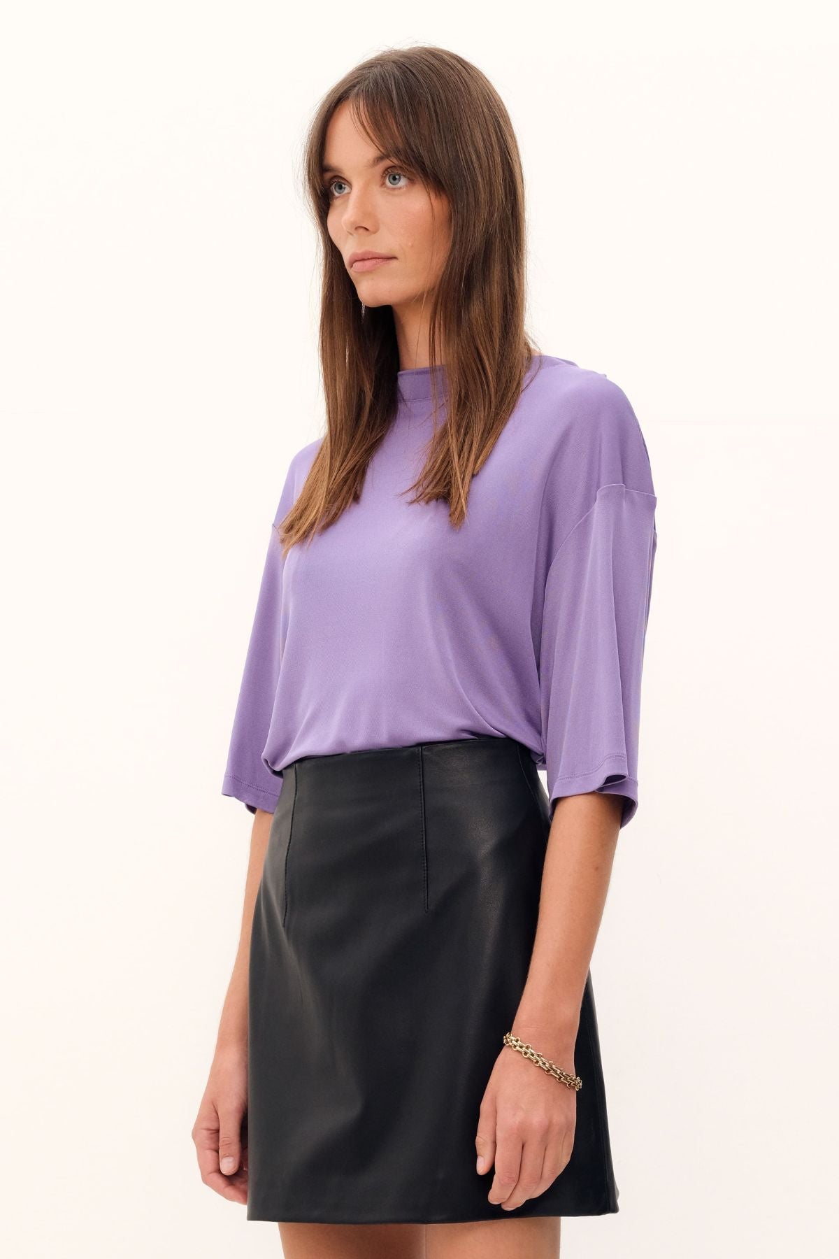 Exquisitely crafted from silk viscose jersey in a delicate lilac hue, the Aphrodite Top boasts a casual tee silhouette, a luxuriously silken knit fabric, and a sleek, high, round neckline.