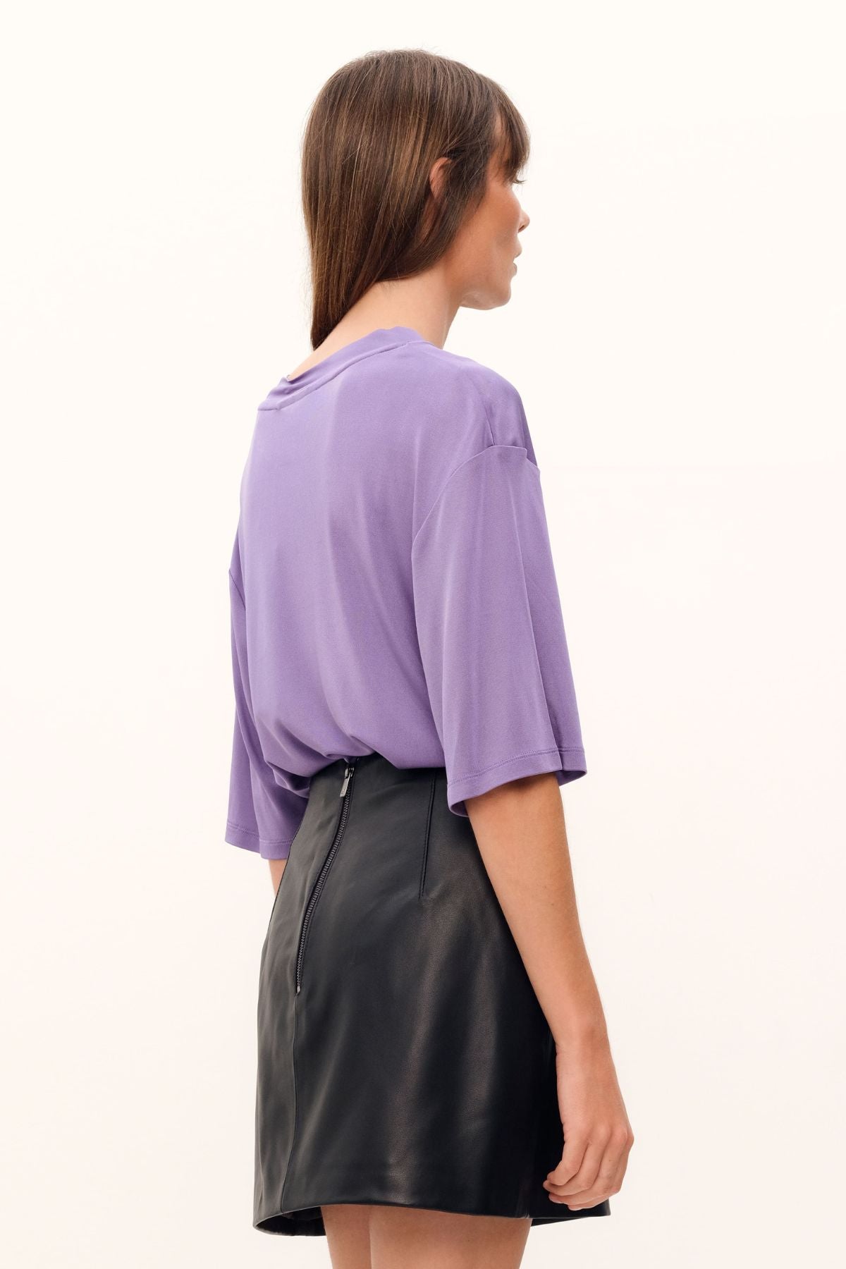 Exquisitely crafted from silk viscose jersey in a delicate lilac hue, the Aphrodite Top boasts a casual tee silhouette, a luxuriously silken knit fabric, and a sleek, high, round neckline.