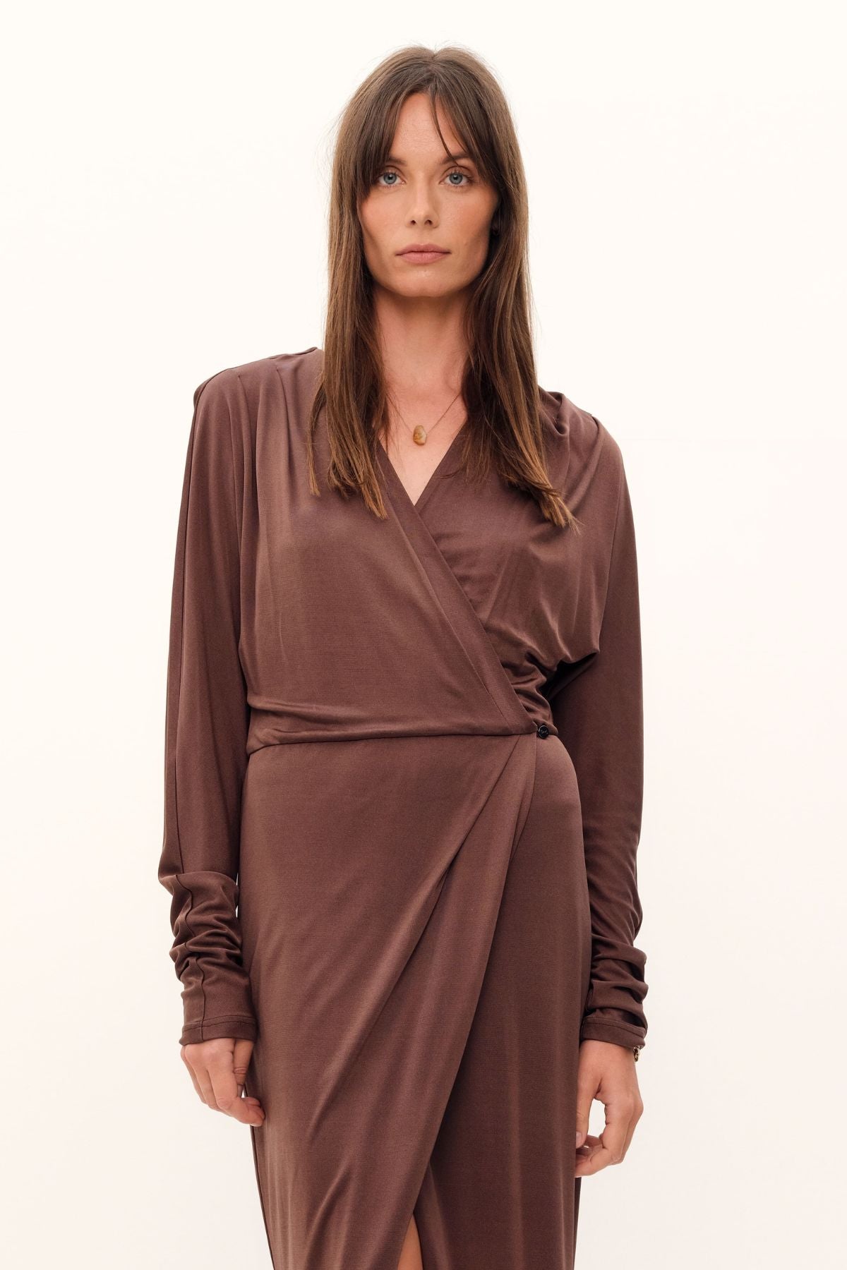 Flowing with sophistication, the Aphrodite Wrap Dress is exquisitely crafted from a luxurious blend of silk viscose jersey in coco. Delicately hugging the curves of the figure, the dress features a cinched waistline, draping down to a midi length with drop-shoulder detailing. Subtly enhancing the silhouette, the feather-light fabric features a relaxed cut, providing an effortless elegance. For an added touch of elegance, add the Novel belt for extra definition. Perfect for both work and evening events.