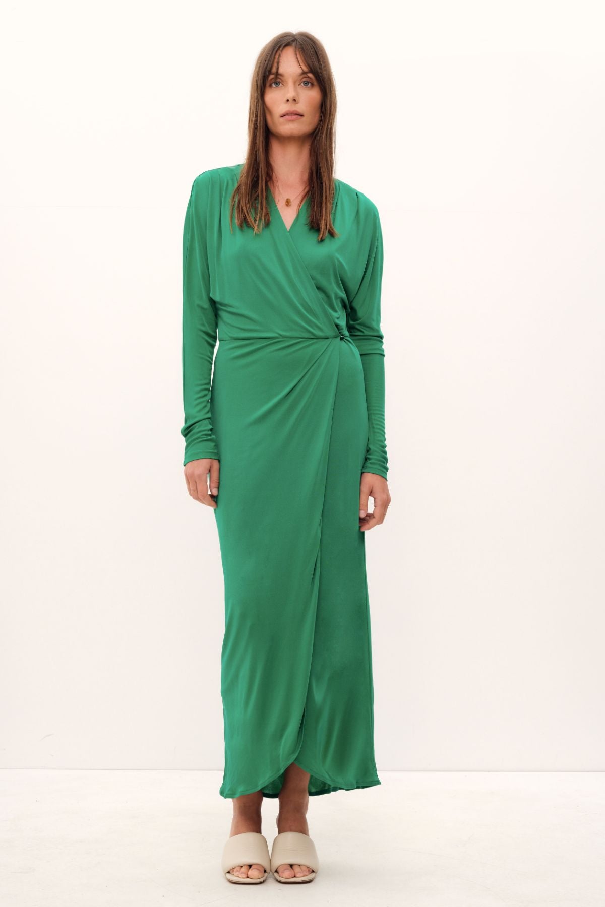 Luxuriously crafted from silk viscose jersey in a lush grass hue, the Aphrodite Wrap Dress exudes undeniable elegance. Cut with a relaxed silhouette, its cinched waistline and delicate stretch fabric combine to create a sumptuously feminine drape. A midi-length, complemented by a cascading drop shoulder design, adds an air of refinement, while a Novel belt makes for a statement-making finish. Perfect for work or evening occasions alike.