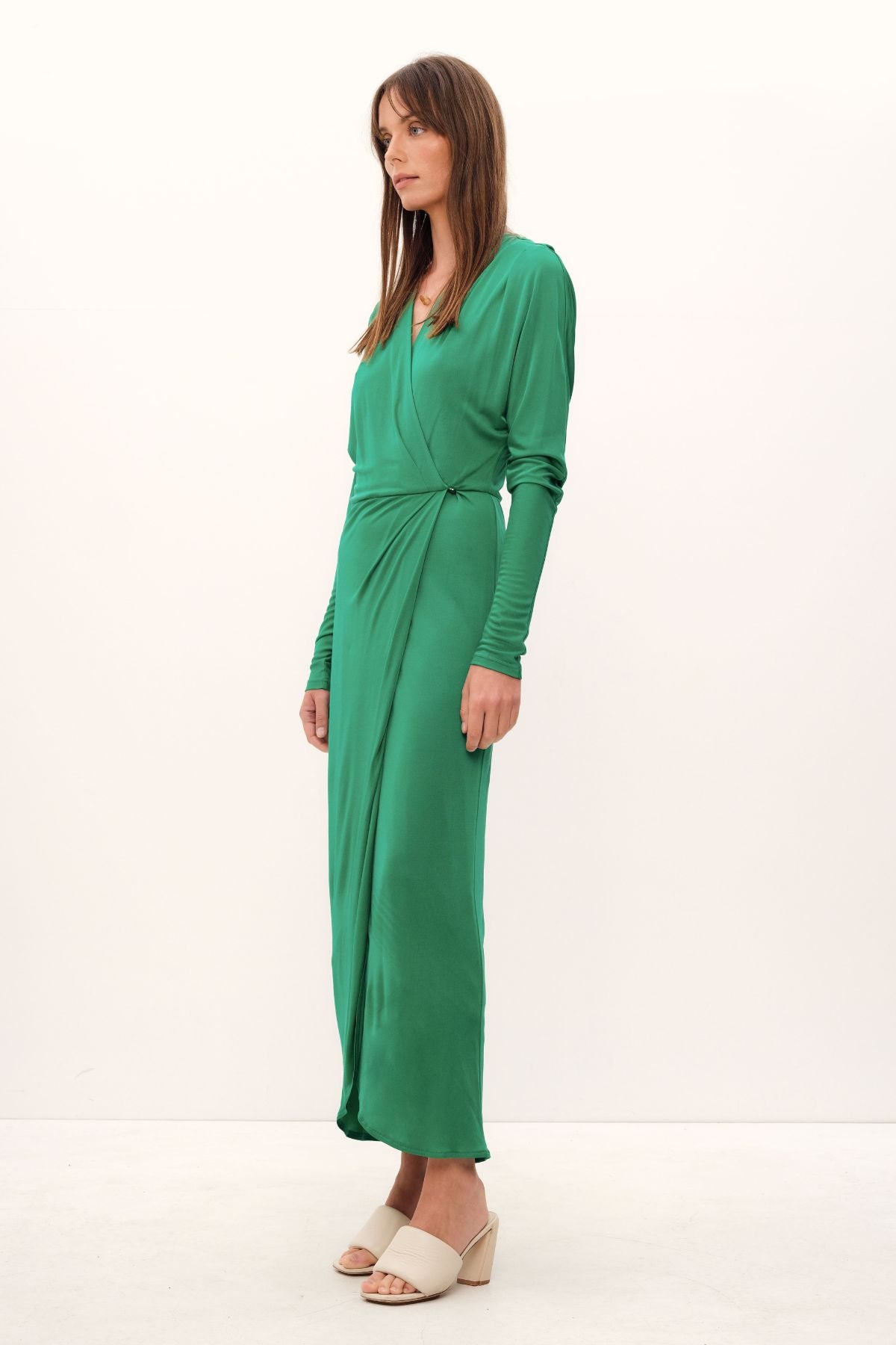 Luxuriously crafted from silk viscose jersey in a lush grass hue, the Aphrodite Wrap Dress exudes undeniable elegance. Cut with a relaxed silhouette, its cinched waistline and delicate stretch fabric combine to create a sumptuously feminine drape. A midi-length, complemented by a cascading drop shoulder design, adds an air of refinement, while a Novel belt makes for a statement-making finish. Perfect for work or evening occasions alike.