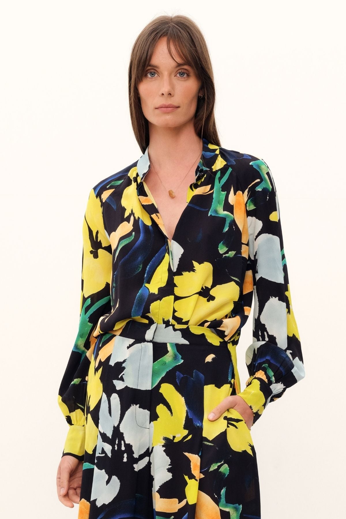 The Silk Hereafter Blouse by GINGER & SMART with a Artful floral print, pastel colors on rich navy base. Mandarin collar, concealed placket, full raglan long sleeve. Lightweight.