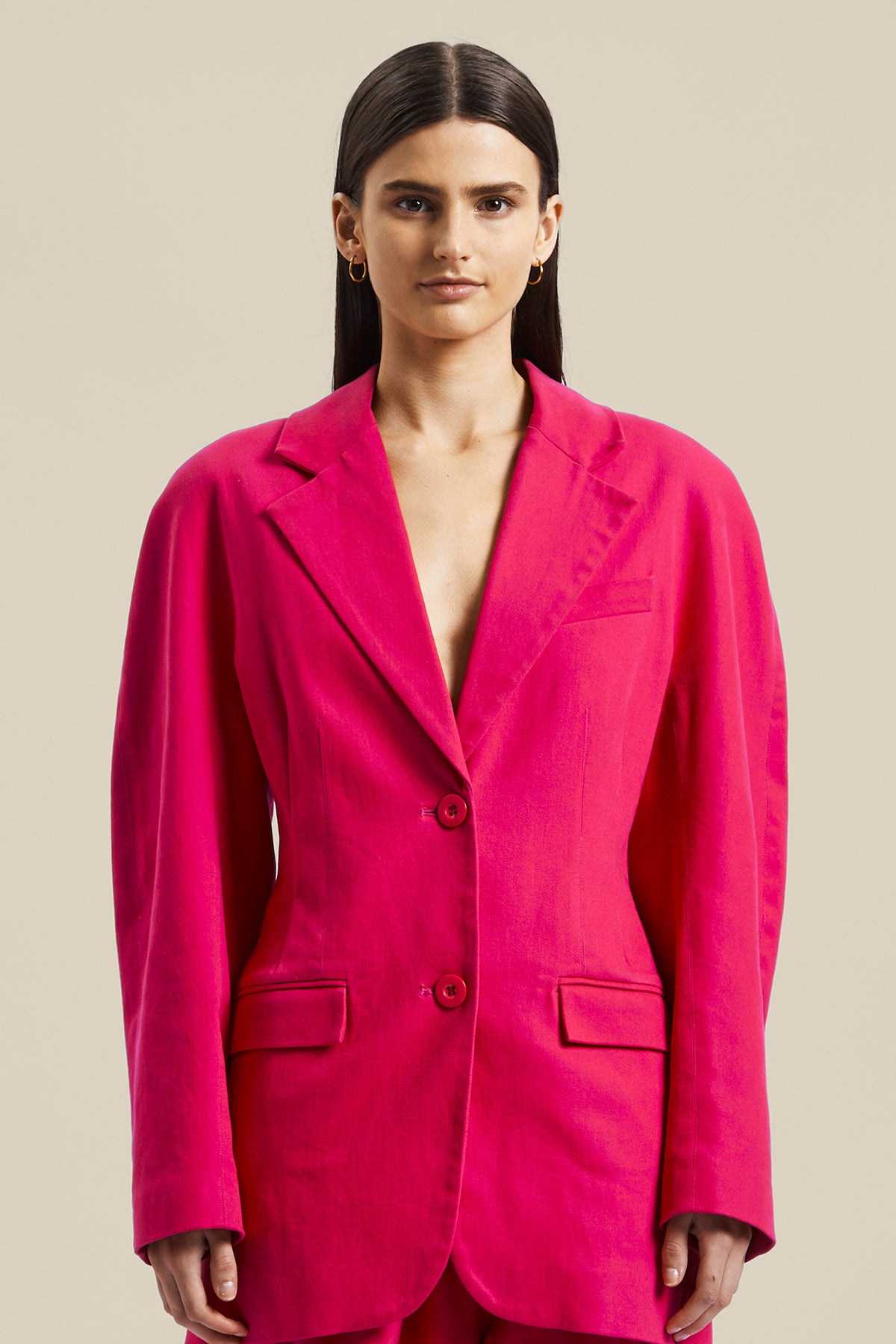 Model wearing the pink Novelist Jacket from Australian fashion designer GINGER & SMART featuring, tailored structural cut and oversized shape. Worn with the pink Novelist Pant.