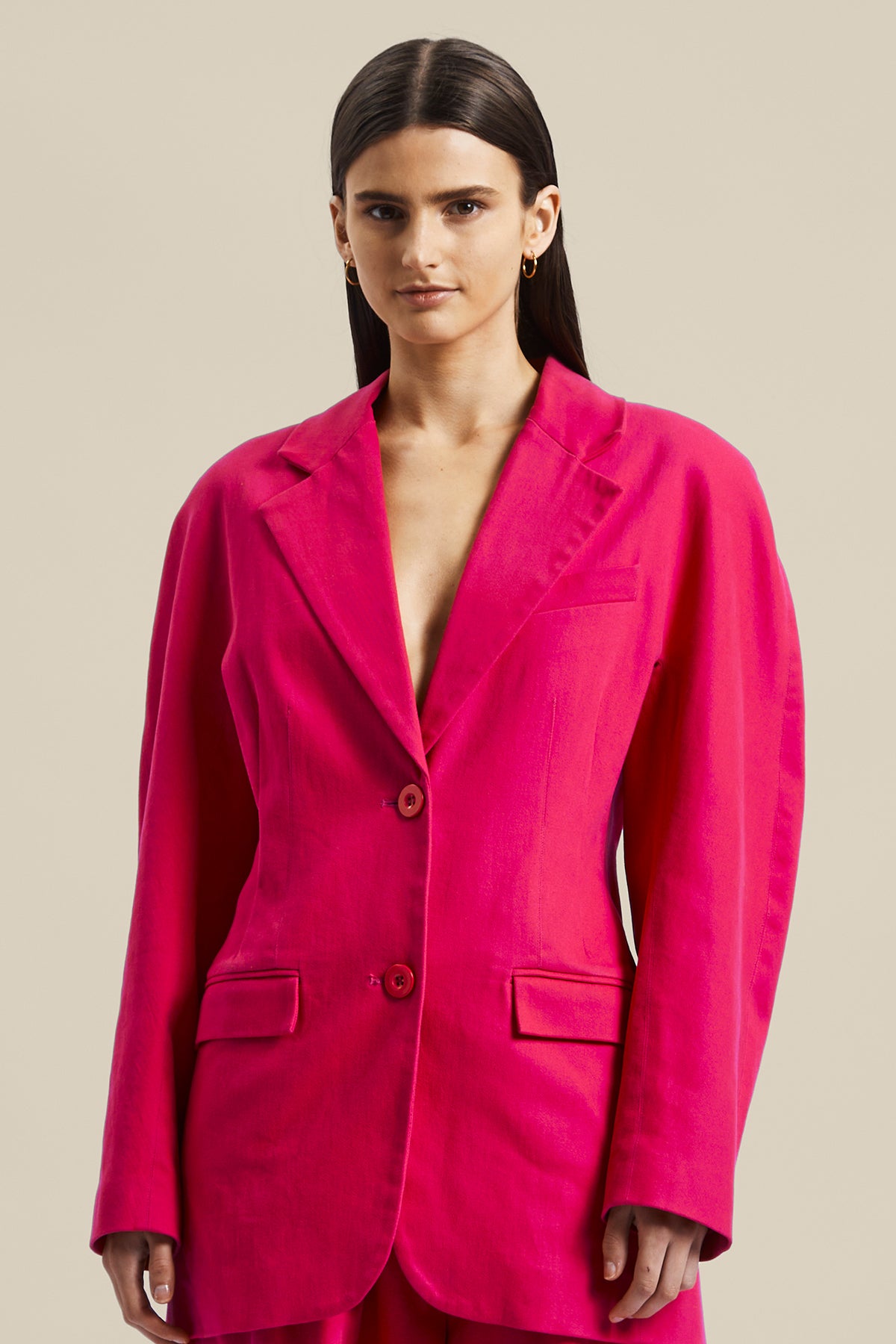 Model wearing the pink Novelist Jacket from Australian fashion designer GINGER & SMART featuring, tailored structural cut and oversized shape. Worn with the pink Novelist Pant.