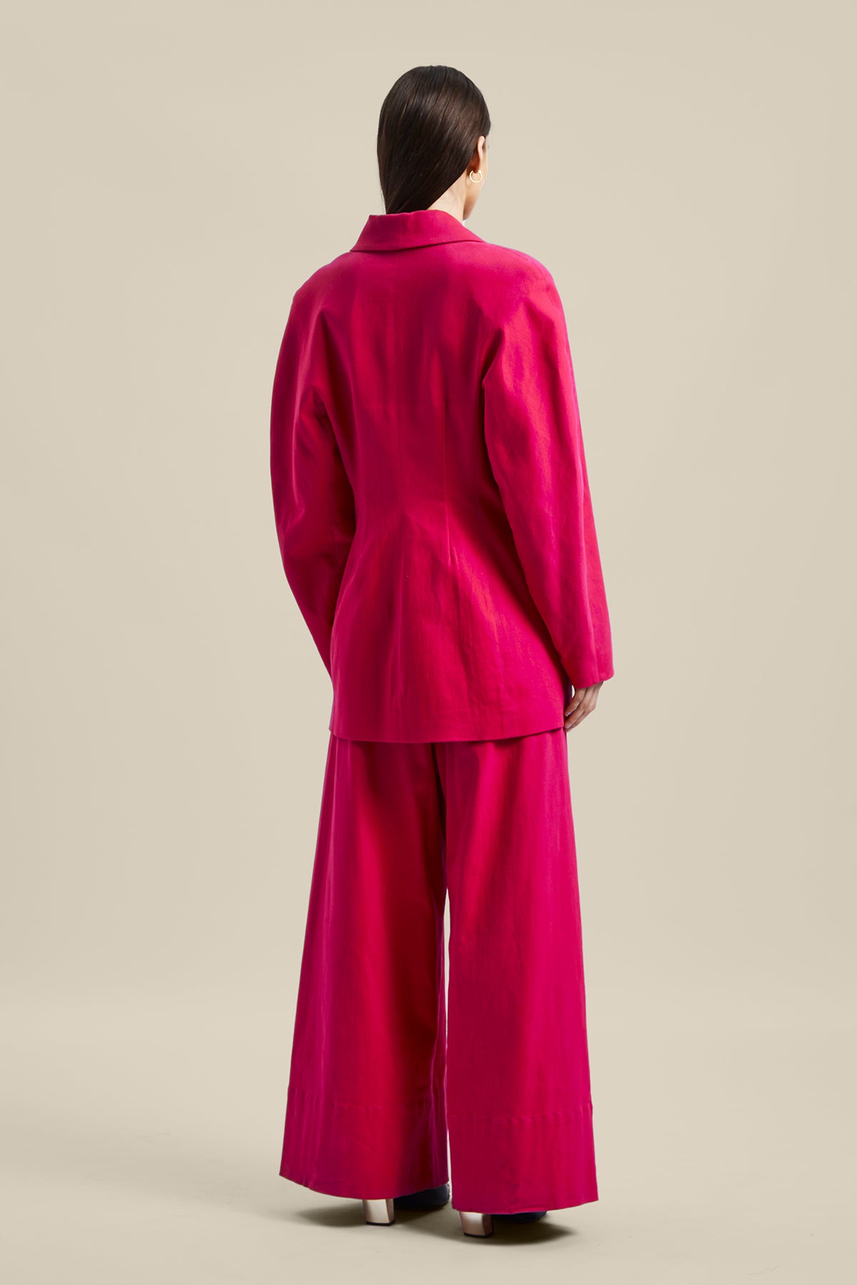Back view of Model wearing the pink Novelist Jacket from Australian fashion designer GINGER & SMART featuring, tailored structural cut and oversized shape. Worn with the pink Novelist Pant.
